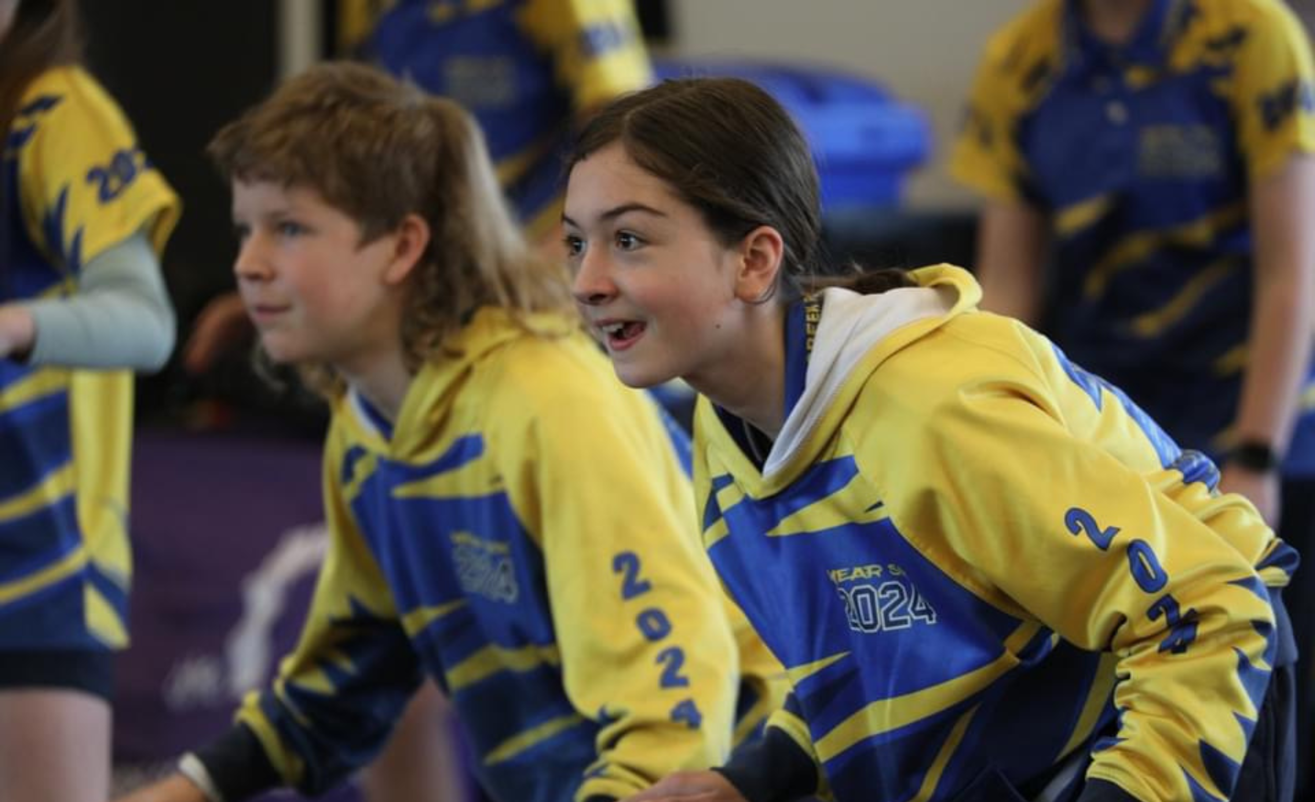 students in uniform dancing
