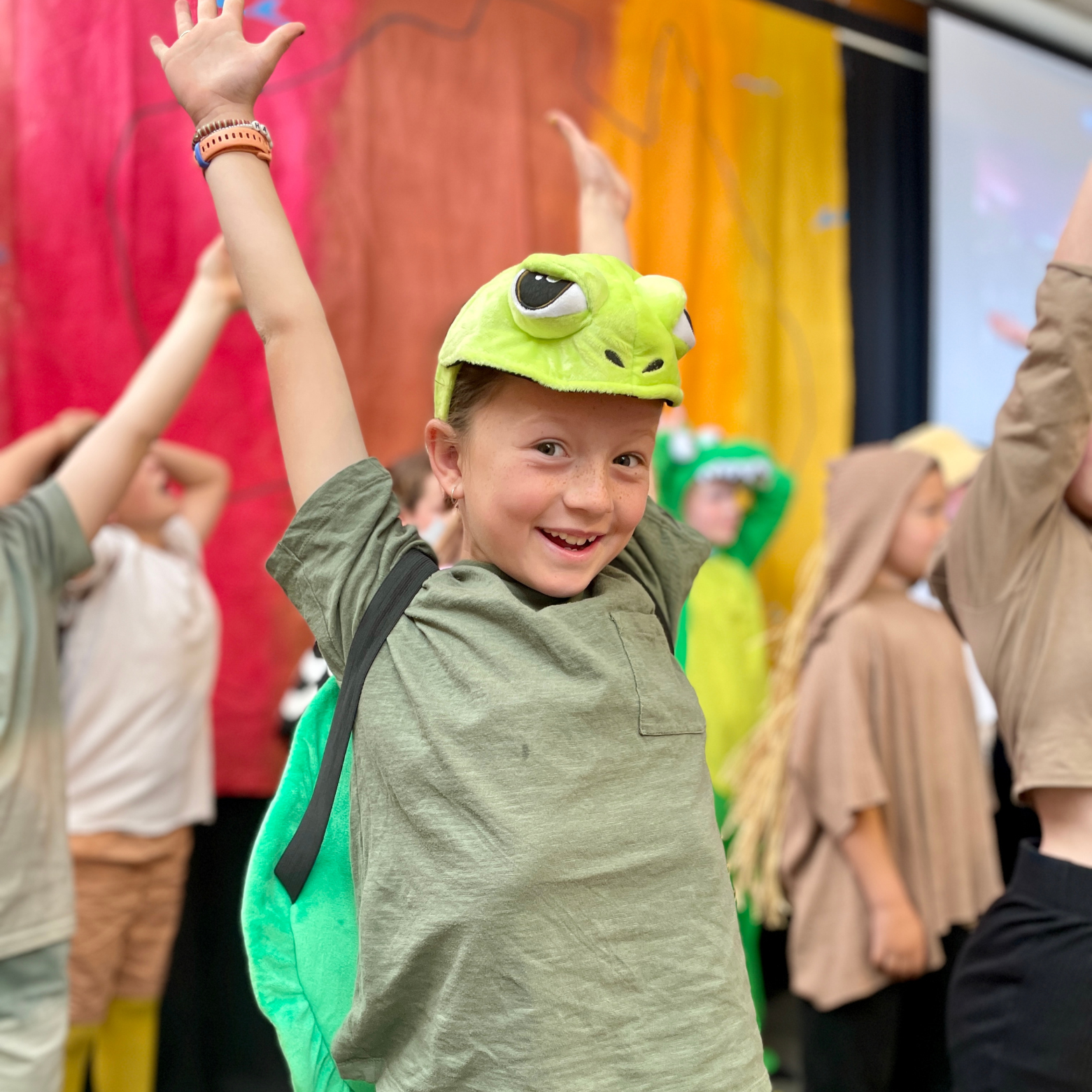 child in frog costume
