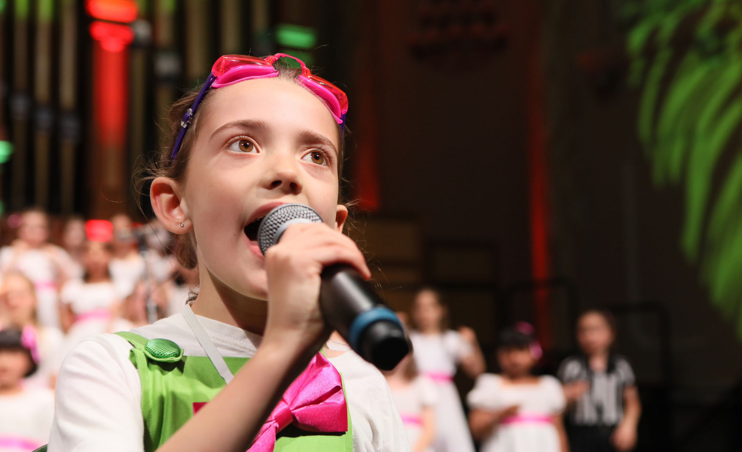 girl in costume performing with mic